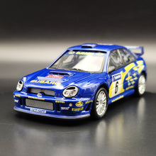 Load image into Gallery viewer, Cararama 2001 Subaru Impreza WRC Rally Car Blue #143 1:43 Die Cast Model
