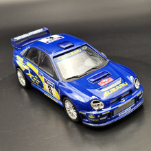Load image into Gallery viewer, Cararama 2001 Subaru Impreza WRC Rally Car Blue #143 1:43 Die Cast Model
