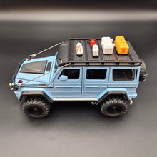 Load image into Gallery viewer, Explorafind 2019 Mercedes-Benz G550 4x4 Squared Sky Blue 1:24 Die Cast SUV