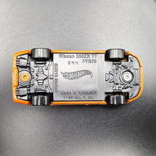 Load image into Gallery viewer, Hot Wheels 2024 Nissan 300ZX Twin Turbo Orange Nightburnerz 5 Pack Exclusive