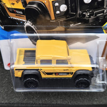 Load image into Gallery viewer, Hot Wheels 2025 '15 Land Rover Defender Double Cab Yellow #179 HW Dirt 10/10 New Long Card