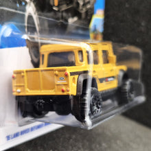 Load image into Gallery viewer, Hot Wheels 2025 '15 Land Rover Defender Double Cab Yellow #179 HW Dirt 10/10 New Long Card