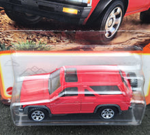 Load image into Gallery viewer, Matchbox 2024 1985 Nissan Pathfinder Red #54 MBX Adventure New Long Card