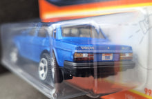 Load image into Gallery viewer, Matchbox 2023 1986 Volvo 240 Light Blue #99 MBX Showroom New Long Card