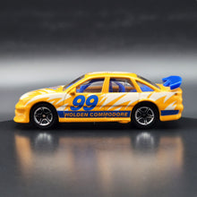 Load image into Gallery viewer, Matchbox 1998 Holden Commodore Orange #64 Matchbox 1-75 Series