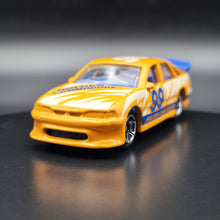 Load image into Gallery viewer, Matchbox 1998 Holden Commodore Orange #64 Matchbox 1-75 Series