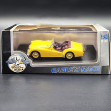 Load image into Gallery viewer, Universal Hobbies Eagle's Race 1955 Triumph TR2 Yellow #3683 1:43 Die Cast Model