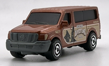 Load image into Gallery viewer, Matchbox 2022 Nissan NV Van Brown #1 MBX Showroom New Sealed Box
