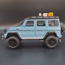 Load and play video in Gallery viewer, Explorafind 2019 Mercedes-Benz G550 4x4 Squared Sky Blue 1:24 Die Cast Car
