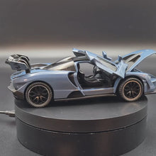 Load and play video in Gallery viewer, Explorafind 2019 McLaren Senna Blue/Grey 1:32 Die Cast Car
