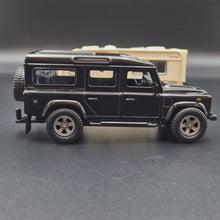 Load and play video in Gallery viewer, Explorafind 2012 Land Rover Defender with Caravan Black/Cream 1:32 Die Cast
