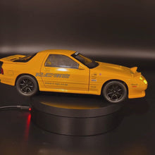 Load and play video in Gallery viewer, Explorafind 1989 Mazda RX-7 Yellow 1:24 Die Cast Car