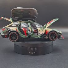 Load and play video in Gallery viewer, Explorafind 2021 Audi RS6 Wagon Green Camouflage 1:24 Die Cast Car