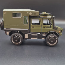 Load and play video in Gallery viewer, Explorafind 2000 Mercedes Benz Unimog Off Road RV Army Green 1:32 Die Cast Truck
