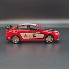 Load and play video in Gallery viewer, Explorafind 2015 Mitsubishi Lancer Evolution Red 1:32 Die Cast Car
