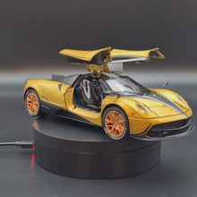 Load and play video in Gallery viewer, Explorafind 2018 Pagani Huayra Gold 1:24 Die Cast Car
