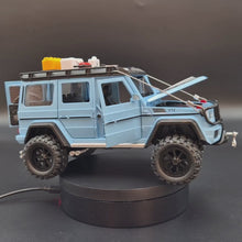 Load and play video in Gallery viewer, Explorafind 2019 Mercedes-Benz G550 4x4 Squared Sky Blue 1:24 Die Cast SUV