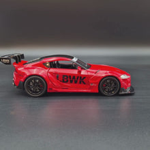 Load and play video in Gallery viewer, Explorafind 2023 Toyota Supra GT4 Red 1:24 Die Cast Race Car