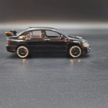 Load and play video in Gallery viewer, Explorafind 2007 Mitsubishi EVO IX Black 1:32 Die Cast Car