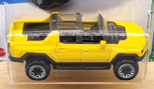 Load image into Gallery viewer, Hot Wheels 2022 GMC Hummer EV Yellow #130 HW Green Speed 3/5 New Long Card
