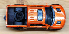 Load image into Gallery viewer, Matchbox 2015 Ford F-150 SVT Raptor Orange #118 MBX Explorers

