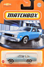 Load image into Gallery viewer, Matchbox 2021 1979 Chevy Nova Light Blue MBX Showroom #22/100 New Long Card
