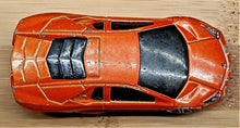 Load image into Gallery viewer, Hot Wheels 2010 Lamborghini Reventón Orange #71 HW Garage 3/10
